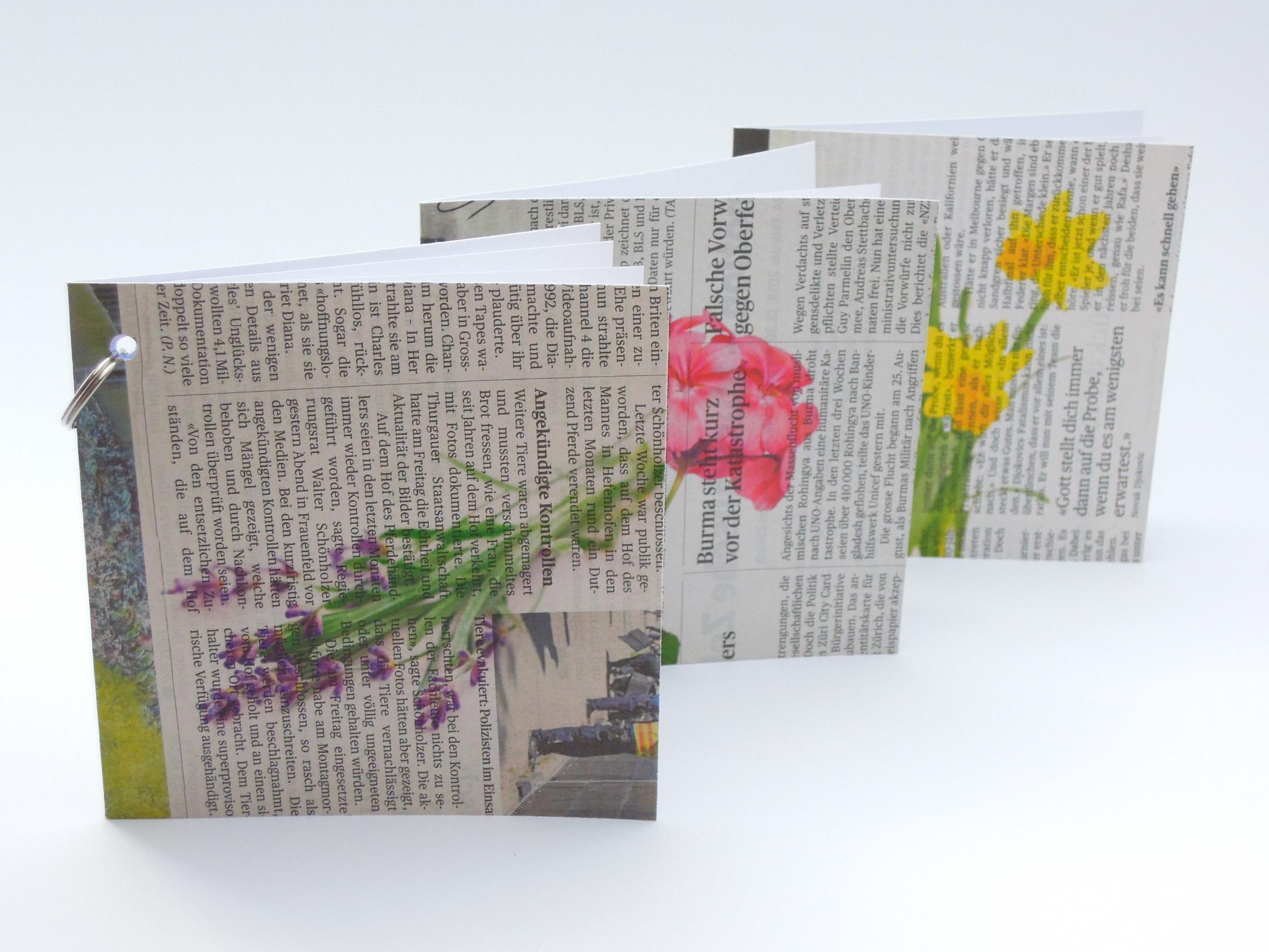Die Up-Cycling Grusskarten werden mit einem Blumensujet bedruckt. Es gibt das Sujet in drei Farben: Lila, Rosa-Pink und Gelb