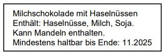 Die Abbildung zeigt die Etikette von Milchschokolade mit Haselnüssen in einer Musterverpackung mit reduzierter Kennzeichnung.