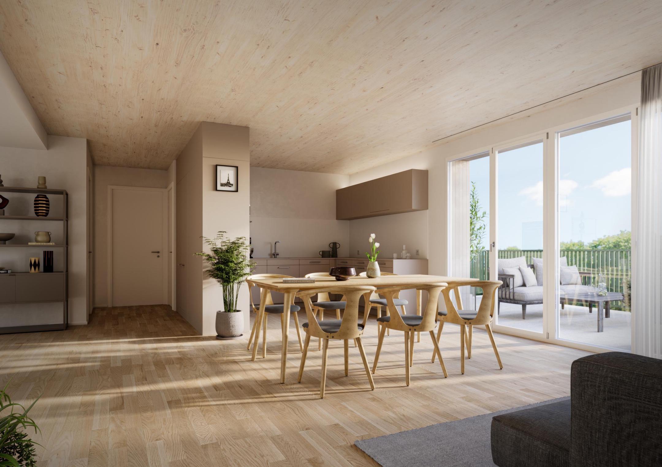 Innenansicht eines hellen Wohnraums mit Holzdecke und -boden, Esstisch mit Stühlen, offener Küche und Zugang zu einer Terrasse mit Glasfront.