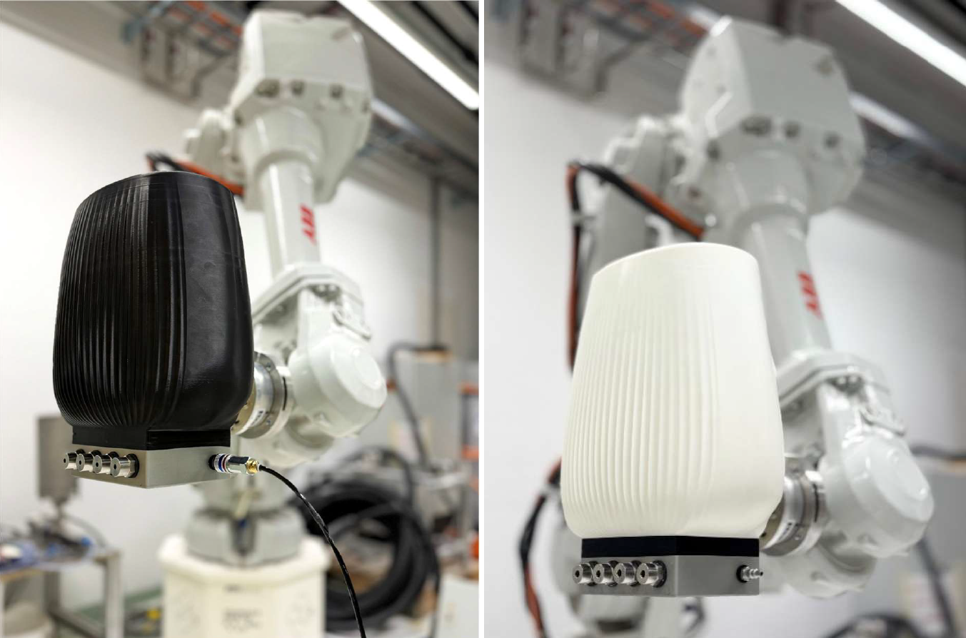 Der zweite Körper ist ein Reservoir für die Paste, in zwei 3D-gedruckten Versionen getestet: Die extern aus Resin in einem Stück gefertigte Variante (weiss, rechts) bewährte sich deutlich besser als die intern an der ETH aus PLA gedruckte Variante (schwarz, links), da die Schichtstruktur des PLA-Drucks ungeeignet war; zudem liess sich das Resin-Reservoir wesentlich leichter reinigen.