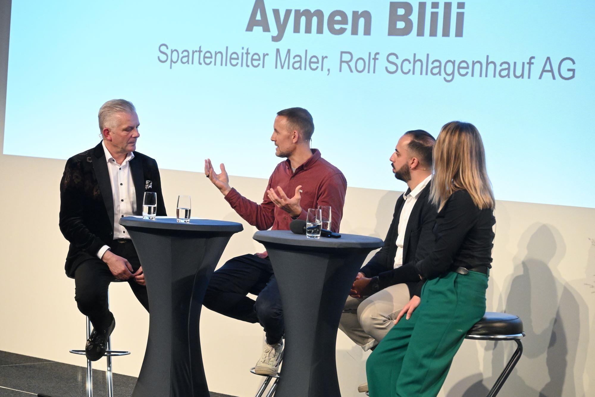 Podiumsdiskussion mit Moderator Rainer Salzgeb
