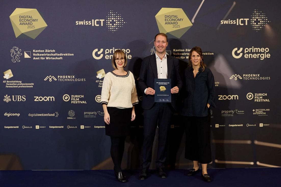The sandbox team is holding their digital economy award certificate